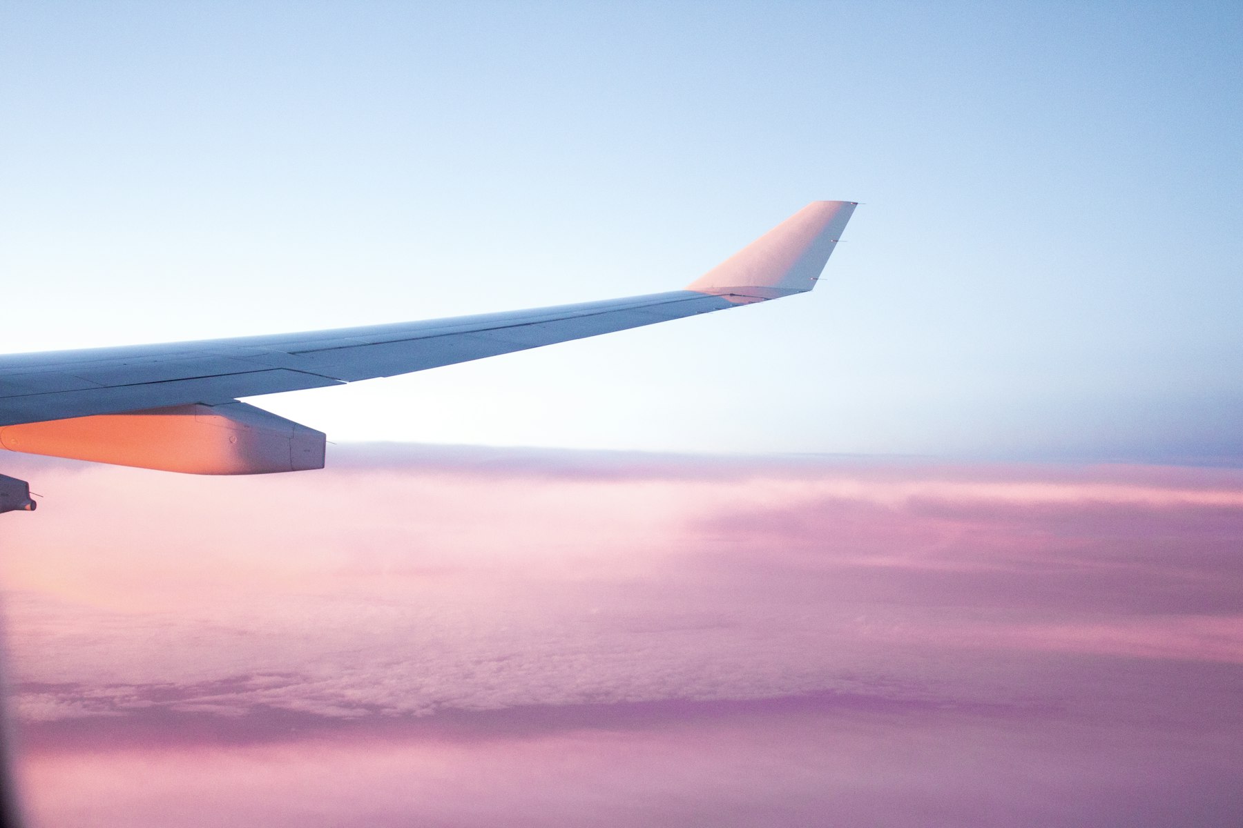Airplane on runway at sunset